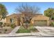Charming single-story home with a two-car garage, landscaped front yard, and a desert-friendly design at 12277 Bluebird Canyon Pl, Las Vegas, NV 89138