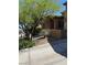 Inviting home featuring desert landscaping, a covered porch, and attractive architectural details at 12277 Bluebird Canyon Pl, Las Vegas, NV 89138