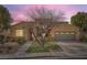 Charming single-story home with a two-car garage, landscaped front yard, and a desert-friendly design at 12277 Bluebird Canyon Pl, Las Vegas, NV 89138