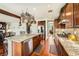 Open kitchen with granite island, stainless steel appliances, and seamless flow to living spaces at 12277 Bluebird Canyon Pl, Las Vegas, NV 89138