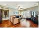 Inviting living room boasts hardwood floors, cozy seating, and abundant natural light at 12277 Bluebird Canyon Pl, Las Vegas, NV 89138