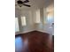 Cozy living area with french doors and shuttered windows, offering bright and airy charm with dark wood flooring at 12277 Bluebird Canyon Pl, Las Vegas, NV 89138