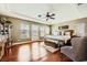 Spacious main bedroom boasts tray ceiling, hardwood floors, seating area, and ample natural light at 12277 Bluebird Canyon Pl, Las Vegas, NV 89138