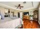 Comfortable main bedroom with hardwood floors and a wooden dresser with ample storage at 12277 Bluebird Canyon Pl, Las Vegas, NV 89138