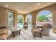 Inviting outdoor living space with comfortable seating and a view of the pool at 12277 Bluebird Canyon Pl, Las Vegas, NV 89138