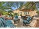 Charming backyard patio with outdoor dining and a fire pit, perfect for entertaining at 12277 Bluebird Canyon Pl, Las Vegas, NV 89138