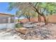 This backyard features desert landscaping and a hot tub at 1596 Fieldbrook St, Henderson, NV 89052