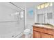 This bathroom features a glass door shower and a granite vanity sink at 1596 Fieldbrook St, Henderson, NV 89052