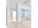 This bedroom features light blue walls and access to the closet and other rooms at 1596 Fieldbrook St, Henderson, NV 89052