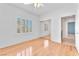 Bright bedroom with hardwood floors, natural light, and mirrored closet at 1596 Fieldbrook St, Henderson, NV 89052