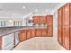 Modern kitchen boasting stainless steel appliances, hardwood cabinets, and granite countertops at 1596 Fieldbrook St, Henderson, NV 89052