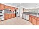Kitchen with stainless steel appliances, wood cabinets, and an open layout at 1596 Fieldbrook St, Henderson, NV 89052