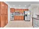 Spacious kitchen featuring stainless steel appliances and hardwood cabinets at 1596 Fieldbrook St, Henderson, NV 89052