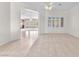 Bright and airy living room with large windows and neutral color palette at 1596 Fieldbrook St, Henderson, NV 89052