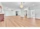 A spacious living room features hardwood floors, a ceiling fan, a built-in cabinet, and decorative lighting at 1596 Fieldbrook St, Henderson, NV 89052