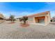 Manicured backyard with stone ground cover and mature landscaping at 1925 Hot Oak Ridge St, Las Vegas, NV 89134