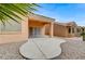 Cozy backyard area featuring a covered patio and easy-care gravel landscaping for outdoor enjoyment at 1925 Hot Oak Ridge St, Las Vegas, NV 89134