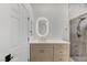 Stylish bathroom features a modern vanity and walk-in shower with gray tile at 1925 Hot Oak Ridge St, Las Vegas, NV 89134