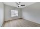 Neutral bedroom featuring modern ceiling fan and view of window at 1925 Hot Oak Ridge St, Las Vegas, NV 89134