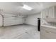 Spacious garage with overhead lighting, storage, and garage door at 1925 Hot Oak Ridge St, Las Vegas, NV 89134