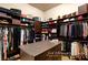 Spacious walk-in closet featuring ample storage and a center island at 23 Quiet Moon Ln, Las Vegas, NV 89135