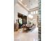 Bright dining area with a wine cellar, chandelier, and tiled flooring at 23 Quiet Moon Ln, Las Vegas, NV 89135