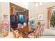 Elegant dining room featuring a large wine cellar, chandelier, and seating for eight at 23 Quiet Moon Ln, Las Vegas, NV 89135