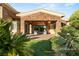 Inviting backyard with garden and patio lounge area for relaxed outdoor living at 23 Quiet Moon Ln, Las Vegas, NV 89135