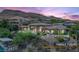 Expansive home with desert landscaping, sunset views, and seamless indoor/outdoor living at 23 Quiet Moon Ln, Las Vegas, NV 89135