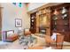 Elegant living room with an onyx stone fireplace, custom built-ins, and sophisticated decor at 23 Quiet Moon Ln, Las Vegas, NV 89135