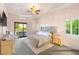 Relaxing main bedroom with private patio access and light-filled ensuite bathroom at 23 Quiet Moon Ln, Las Vegas, NV 89135