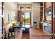 Bright home office with fireplace, built-in shelving, and views of outdoor living space at 23 Quiet Moon Ln, Las Vegas, NV 89135
