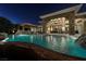 Gorgeous pool with integrated spa and waterfall features, complemented by a beautifully landscaped backyard at 23 Quiet Moon Ln, Las Vegas, NV 89135