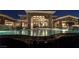Luxurious backyard oasis with a large pool, waterfalls, and ample space for relaxation and entertainment at 23 Quiet Moon Ln, Las Vegas, NV 89135