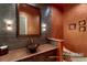 Stunning powder bath with decorative bowl sink, textured wall, and modern fixtures at 23 Quiet Moon Ln, Las Vegas, NV 89135