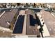 Aerial view of a home with solar panels on a tile roof, highlighting the property's energy efficiency and modern design at 257 Via Franciosa Dr, Henderson, NV 89011