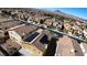 This aerial view displays neighborhood homes with solar panels, landscaping, and easy access to local amenities at 257 Via Franciosa Dr, Henderson, NV 89011