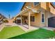 Backyard features turf, brick patio, pergola, and privacy wall at 257 Via Franciosa Dr, Henderson, NV 89011