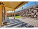 Outdoor patio with pergola, turf, and privacy wall at 257 Via Franciosa Dr, Henderson, NV 89011