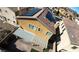 Aerial view of a backyard with a patio cover, low maintenance landscaping and a small artificial turf area at 257 Via Franciosa Dr, Henderson, NV 89011