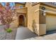 The front entrance showcases an arched brick entryway, a well-lit porch, and manicured landscaping at 257 Via Franciosa Dr, Henderson, NV 89011