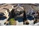 Aerial view of a two-story home with desert landscaping, a two car garage and solar panels at 257 Via Franciosa Dr, Henderson, NV 89011