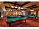 A game room with multiple billiard tables under pendant lighting at 257 Via Franciosa Dr, Henderson, NV 89011