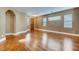 Bright living room with beautiful hardwood floors and multiple windows providing natural light at 257 Via Franciosa Dr, Henderson, NV 89011