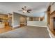 Spacious living room with hardwood floors, a fireplace, and a view of the modern kitchen at 257 Via Franciosa Dr, Henderson, NV 89011