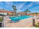 A swimming pool with a lap lane and a covered patio in a community area at 257 Via Franciosa Dr, Henderson, NV 89011