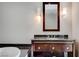 Bathroom vanity features a large framed mirror and attractive sconces at 2700 Las Vegas Blvd # 3507, Las Vegas, NV 89109