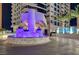 The building boasts a grand entrance with vibrant lighting and lush landscaping at 2700 Las Vegas Blvd # 3507, Las Vegas, NV 89109