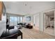 Spacious living room with wood floors and access to a private balcony, offering stunning city views and natural light at 2700 Las Vegas Blvd # 3507, Las Vegas, NV 89109