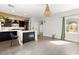 Kitchen with marble island featuring cabinet storage and a pendant chandelier at 2876 Strathallan Ave, Henderson, NV 89044